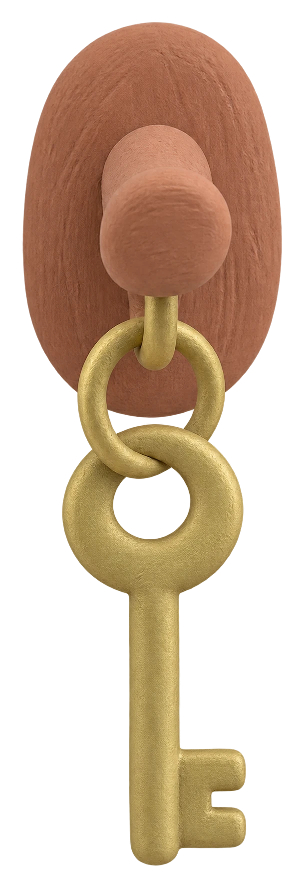 A brass clay key hanging from a wooden peg